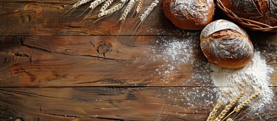 Poster - Wooden table with rustic bread, wheat ears, and white flour, all set up for display with a spacious copy space image.