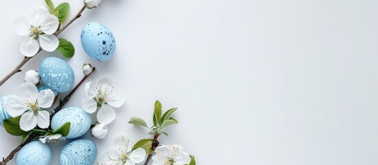 Poster - White Easter concept with decorations on a white background featuring a copy space image. Easter greeting card. Flat lay with an apple tree twig, blue eggs, and a white flower to celebrate the Easter