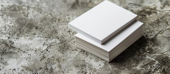 Poster - Two stacks of blank paper business cards displayed on a textured background, providing copy space image.