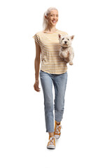 Canvas Print - Young woman holding a westie terrier dog