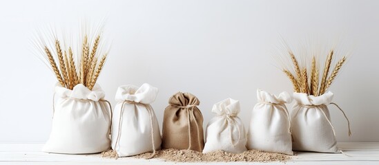 Poster - White background with copy space image featuring bags filled with wheat flour.