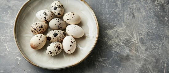 Poster - White porcelain plates presented with a display of quail eggs, ideal for showcasing with a copy space image.
