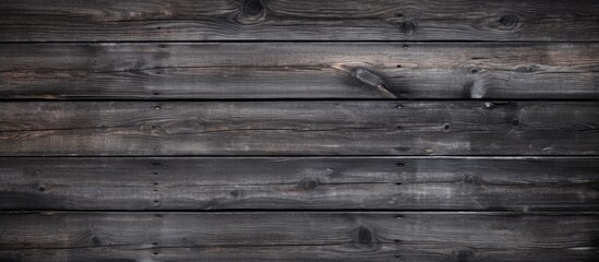Poster - Rustic dark wooden texture with an old black and grey color palette creating a captivating wood background, perfect for a copy space image.