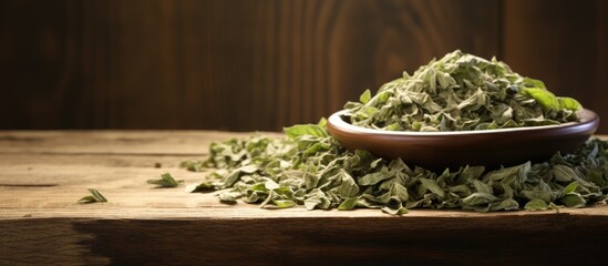 Sticker - Dried basil flakes stack on rustic wood, ideal as a background for a copy space image.