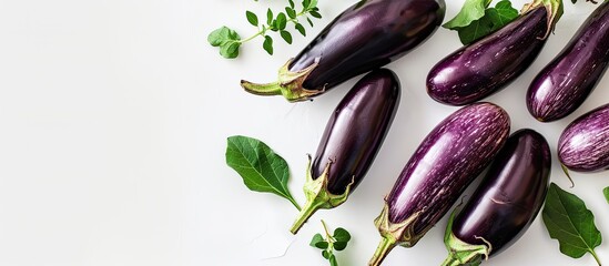 Aufkleber - Fresh organic eggplants with copy space image on white backdrop.