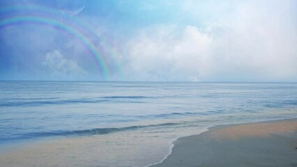 Wall Mural - storm's end double rainbow promise 4k loop features ocean waves crashing onto the shore with a light