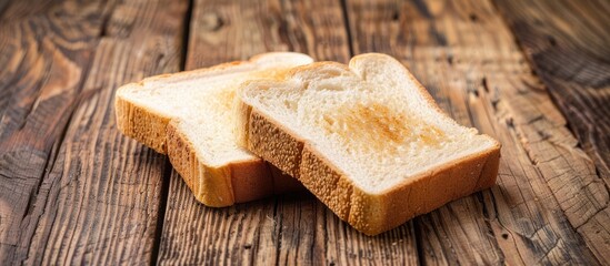 Poster - Two slices of white bread on a wooden table, perfect for breakfast, delicious, soft, and enjoyable with butter, jam, or for creating sandwiches. Ideal for a copy space image.