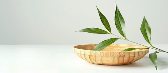 Sticker - Isolated on a white backdrop, a bamboo saucer is featured with copy space image.