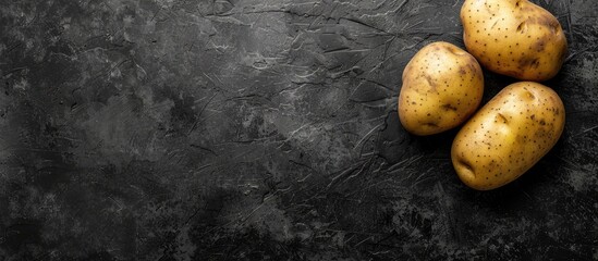 Sticker - Potato displayed on a dark background with ample copy space image.