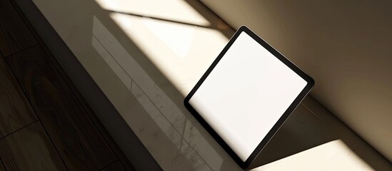 Aufkleber - Digital tablet mockup with a white screen template placed on a corner of a table, set in natural lighting and shadow, ideal for copy space image.