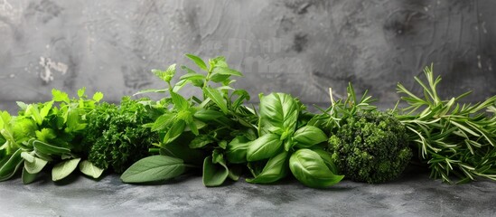 Aufkleber - On a gray table, there is a bunch of fresh herbs with a banner providing copy space image.