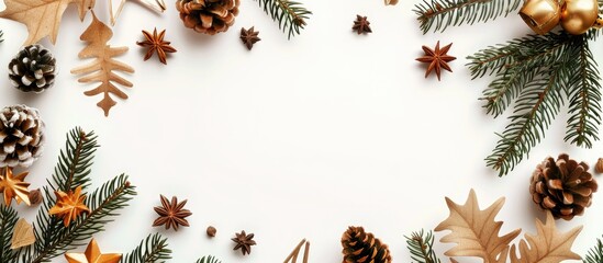 Poster - Flat lay top view of a Christmas frame adorned with gold decorations like pine cones, star anise, and spruce branches on a white background with room for text or images.