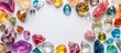 © HN Works - Various loose colorful gemstones on a white backdrop, perfect as copy space for jewelry and gem-themed wallpaper.