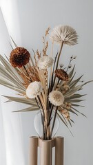 Wall Mural - Dried flowers in vase against light gray background