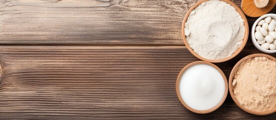 Poster - Top view of spa products and cosmetic clay on a wooden background with copy space image.