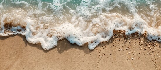 Aufkleber - Detailed view of sand with a gentle wave, presenting a serene coastal scene alongside a copy space image.