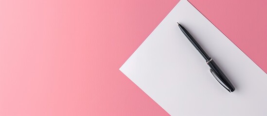 Fototapete - Pink background showcasing a white sheet of paper with a pen in the frame, ideal for adding text, featuring copy space image.