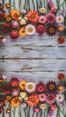 Flat lay of flower border on wooden background