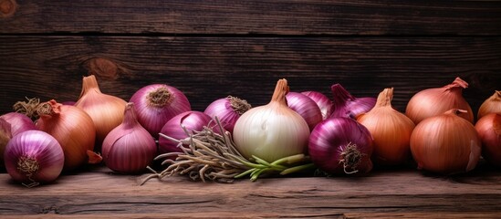 Poster - Onions arranged on a rustic wooden table with a weathered look, surrounded by a copy space image.