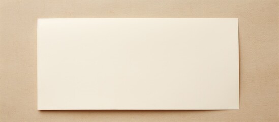 Aufkleber - Overhead view of a blank white paper on a beige background with copy space image.