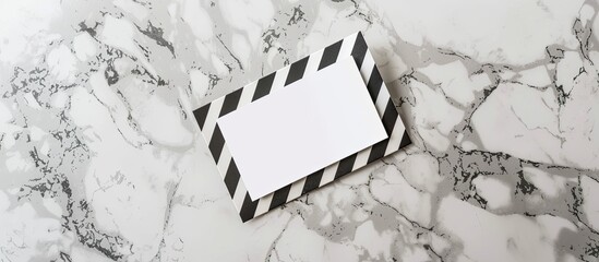 Poster - Top view of a striped employee badge and postcard arranged on a marble surface for a mockup with copy space image.