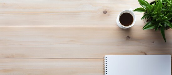 Poster - Top view of wood office desk with blank notebook, pen, laptop, and supplies, creating a visually appealing flat lay composition with ample copy space image.