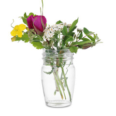 Wall Mural - Different flowers in glass vase isolated on white
