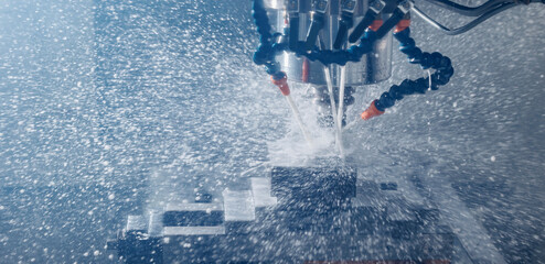 Wall Mural - Working closeup CNC turning cutting metal Industry machine iron tools with splash cutting fluid water
