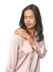 Wall Mural - simple portrait of a young latina having a shoulder pain.