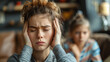 © Ramses - a woman has headache and stress because of children's problems , children on background .A mother suffers from headaches, tension and psychological pressure due to her children’s problems