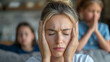 © Ramses - a woman has headache and stress because of children's problems , children on background .A mother suffers from headaches, tension and psychological pressure due to her children’s problems