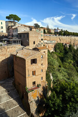 Poster - view of historic stone buildings built on tuff rock in the town of Pitigliano