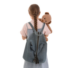 Wall Mural - Little schoolgirl with toy bear and backpack on white background, back view