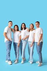Wall Mural - Group of young people in stylish jeans on blue background