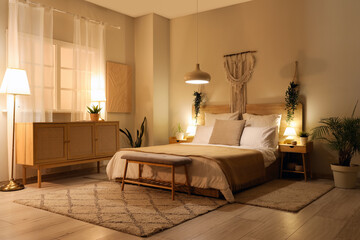 Wall Mural - Interior of bedroom with modern furniture and glowing lamps at night