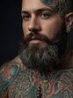 © RENDISYAHRUL - a man with tattoos and a beard
