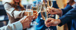 © FATHOM - Business people celebrating with champagne in the office, toasting to success