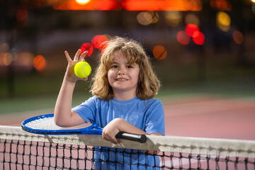 Canvas Print - The Tennis. Kid with tennis racket and tennis ball playing on tennis court.