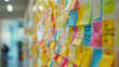 © Chatchanan - A creative brainstorming session in a conference room, with colorful post-it notes and diagrams on the walls