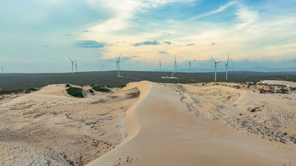 Wall Mural - windmill park with clouds and a blue sky, wind mill turbines in the ocean aerial view of a wind farm