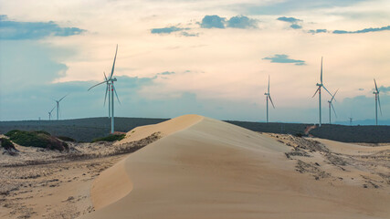 Wall Mural - windmill park with clouds and a blue sky, wind mill turbines in the ocean aerial view of a wind farm
