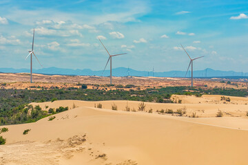 Wall Mural - windmill park with clouds and a blue sky, wind mill turbines in the ocean aerial view of a wind farm