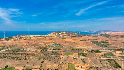 Wall Mural - panoramic view of wind farm or wind park, with high wind turbines for generation electricity with co