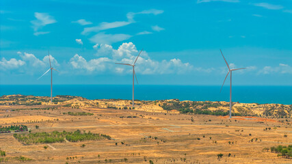 Wall Mural - panoramic view of wind farm or wind park, with high wind turbines for generation electricity with co