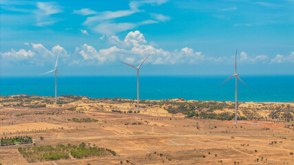 Wall Mural - panoramic view of wind farm or wind park, with high wind turbines for generation electricity with co
