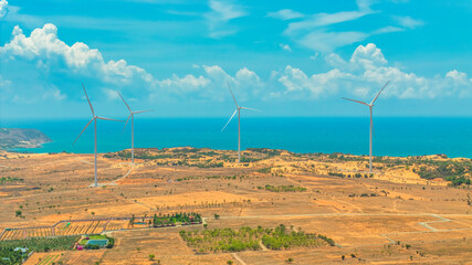 Wall Mural - panoramic view of wind farm or wind park, with high wind turbines for generation electricity with co