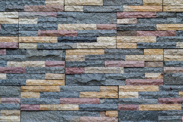 Wall Mural - Stone cladding wall made of striped stacked slabs of natural brown rocks, wall texture background