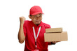 © Jamaludinyusup - Asian delivery man or courier stands triumphantly, clenching his fist in a YES gesture while holding a cardboard box, isolated on a white background. Concepts of achievement and delivery service