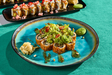 Wall Mural - Close-Up of Tempura Roll with Salad Mix and Sweet Chili Sauce on Vibrant Plate