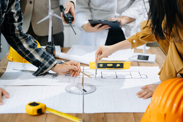 Wall Mural - Engineer teams meeting working together wear worker helmets hardhat on construction site